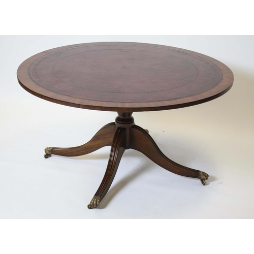 291 - LOW TABLE, 53cm H x 100cm D, Georgian style mahogany with circular red leather top on brass castors.