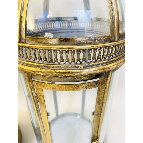 426 - STORM LANTERNS, pair, 80cm high, 28cm diameter, Regency style, gilt metal and glass. (2)