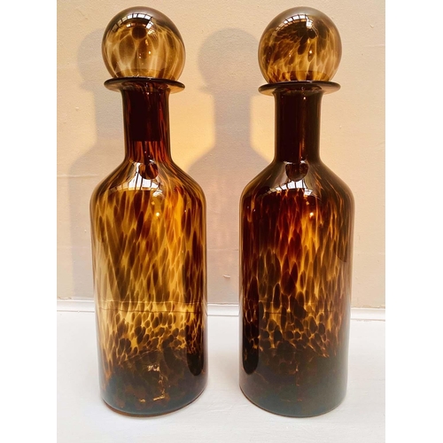 446 - DECANTERS, a pair, 53cm H x 14cm diam., Murano style tortoiseshell glass. (2)