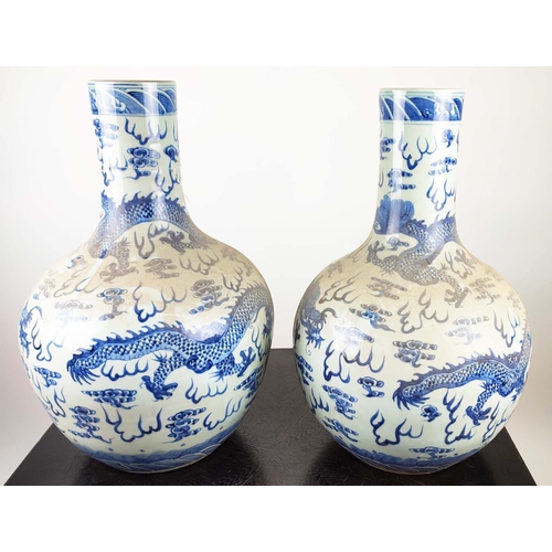 489 - BOTTLES VASES, a pair, Chinese Export style blue and white ceramic, 60cm H. (2)