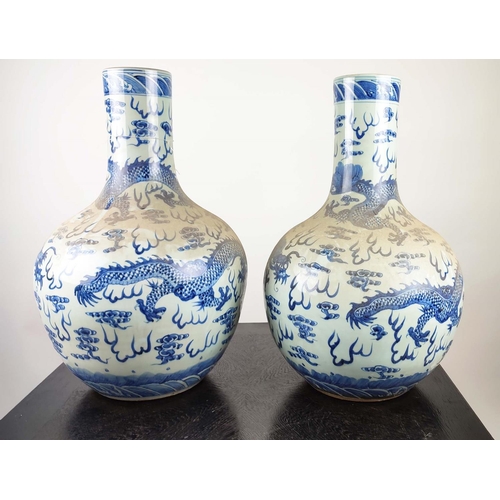 489 - BOTTLES VASES, a pair, Chinese Export style blue and white ceramic, 60cm H. (2)