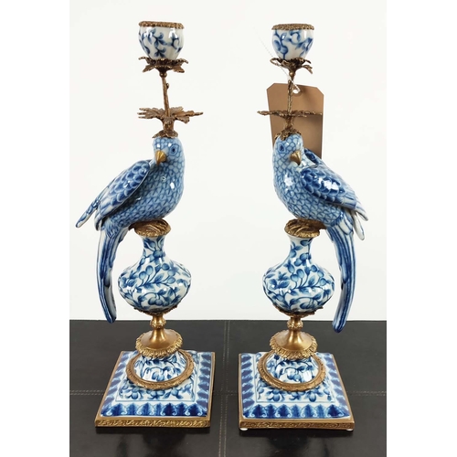 494 - CANDELABRA, a pair, 48cm H, in the form of birds, blue and white ceramic, gilt mounts. (2)