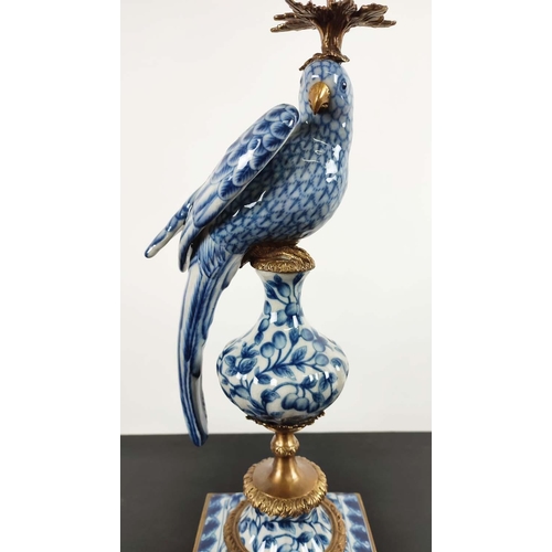 494 - CANDELABRA, a pair, 48cm H, in the form of birds, blue and white ceramic, gilt mounts. (2)