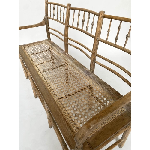 224 - FAUX BAMBOO HALL SEAT, 19th century English carved faux bamboo framed with down swept arms and cane ... 