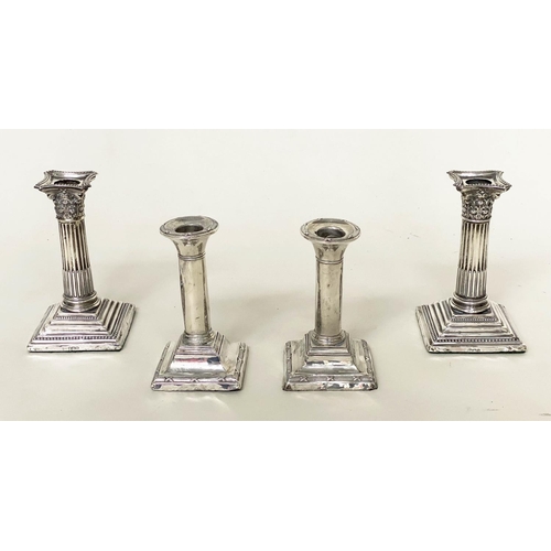 292 - CANDLESTICKS, a pair, Edward VII silver with square reeded bases Chester 1910, together with a pair ... 