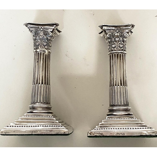 292 - CANDLESTICKS, a pair, Edward VII silver with square reeded bases Chester 1910, together with a pair ... 