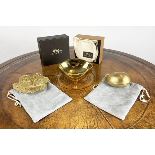 44 - AERIN CREAM SHAGREEN COASTERS, a boxed set of four with suede underside and gold toned brass rim alo... 