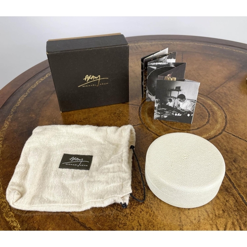 44 - AERIN CREAM SHAGREEN COASTERS, a boxed set of four with suede underside and gold toned brass rim alo... 