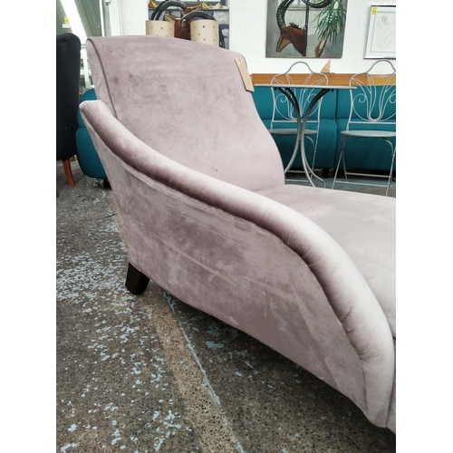 331 - JOHN SANKEY CHAISE LOUNGE, 150cm x 67cm x 88cm, purple fabric upholstered, with contrasting piping.