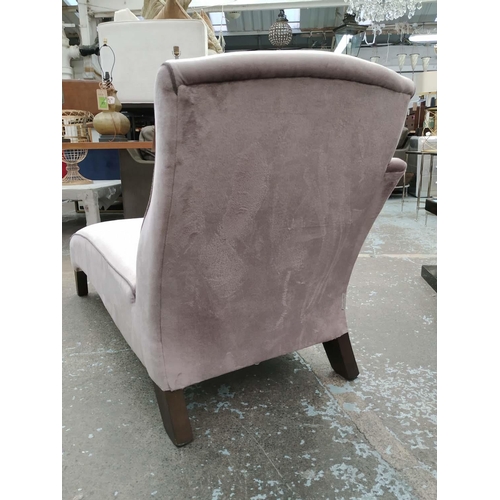 331 - JOHN SANKEY CHAISE LOUNGE, 150cm x 67cm x 88cm, purple fabric upholstered, with contrasting piping.