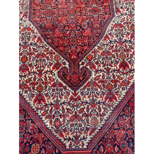 137 - ANTIQUE PERSIAN FEREGHAN RUG, 196cm x 127cm.