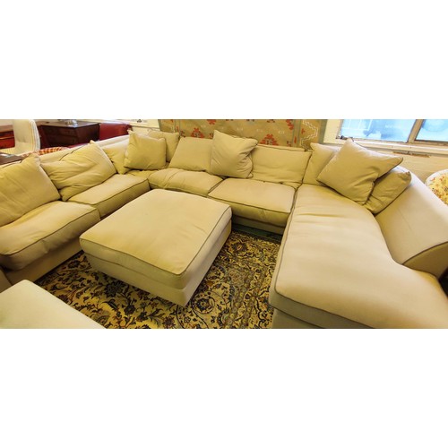 482 - COLLINS & HAYES MODULAR SOFA, neutral upholstered with grey piping approx 390cm x 280cm x 200cm and ... 