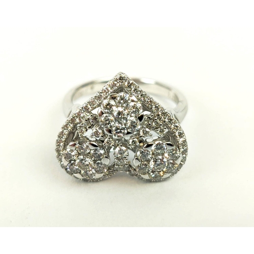 11 - AN 18CT WHITE GOLD DIAMOND DRESS RING, the head in the form of a heart, encrusted with round brillia... 