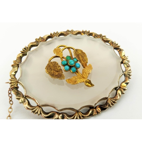 21 - A LATE VICTORIAN YELLOW METAL AND CLEAR CHALCEDONY SET BROOCH, of oval form, probably 15ct gold, ove... 