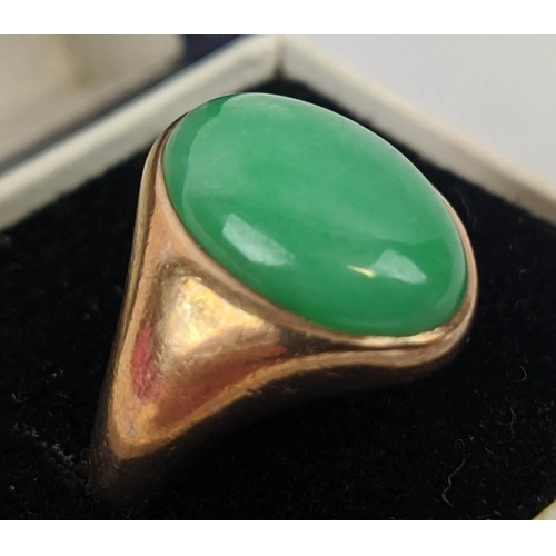 28 - A YELLOW METAL JADE CABOUCHON SET DRESS RING, probably 18ct gold, ring size M, 8.4 grams.