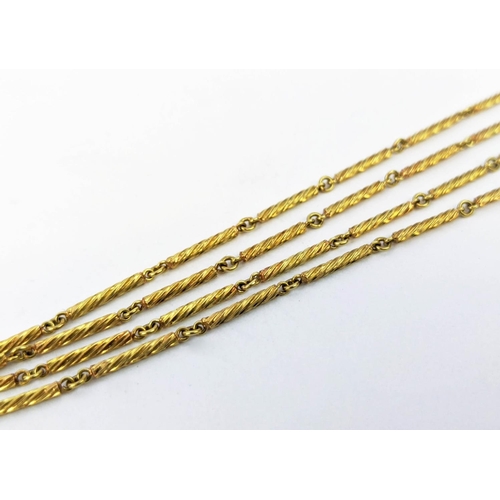29 - A YELLOW METAL BAR-LINK NECKLACE, each link spiral engraved, 76cm long, 15.74 grams.