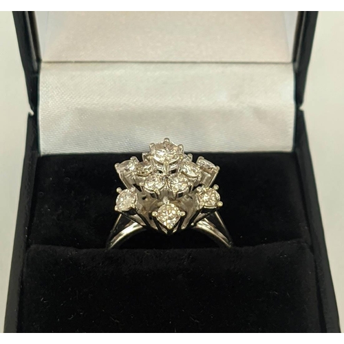 6 - AN 18CT WHITE GOLD DIAMOND FLOWER HEAD COCKTAIL RING, with a central stone of approximately 0.25 car... 