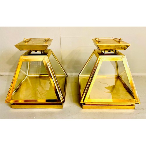 441 - WALL HANGING LANTERNS, pair, 31cm high, 29cm wide, pyramid form, gilt metal frames and glass sides. ... 