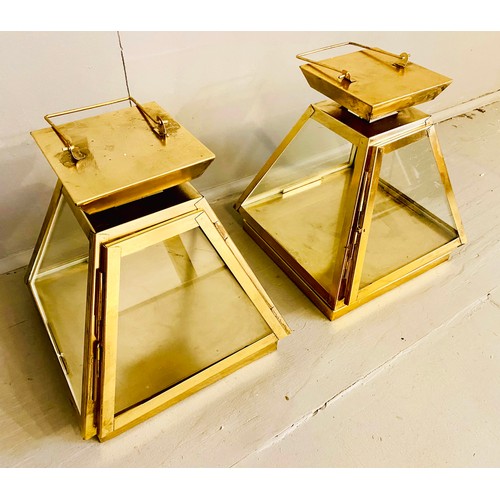 441 - WALL HANGING LANTERNS, pair, 31cm high, 29cm wide, pyramid form, gilt metal frames and glass sides. ... 