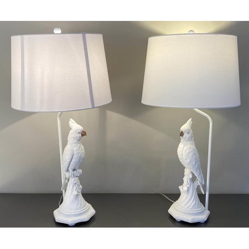 482 - TABLE LAMPS, a pair, in the form of cockatoos, with shades, 
76cm x 38cm x 38cm. (2)