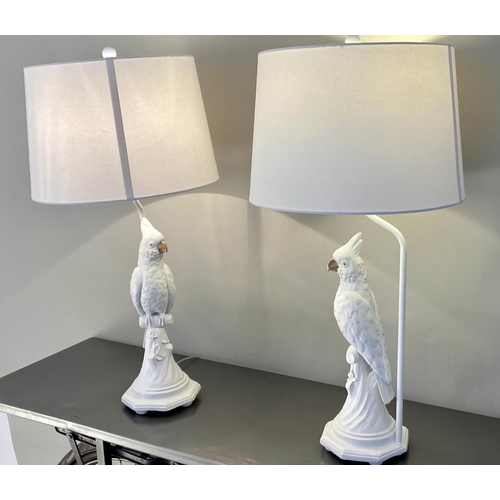 482 - TABLE LAMPS, a pair, in the form of cockatoos, with shades, 
76cm x 38cm x 38cm. (2)