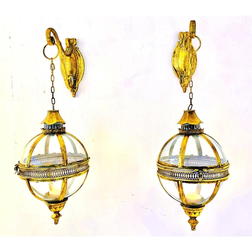 481 - WALL HANGING CANDLE LANTERNS, a pair, Regency style, gilt metal and glass, 80cm x 25cm x 25cm. (2)