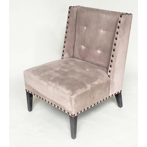 265 - WING CHAIR, brass studded and buttoned suede upholstered with tapering supports, 61cm W.