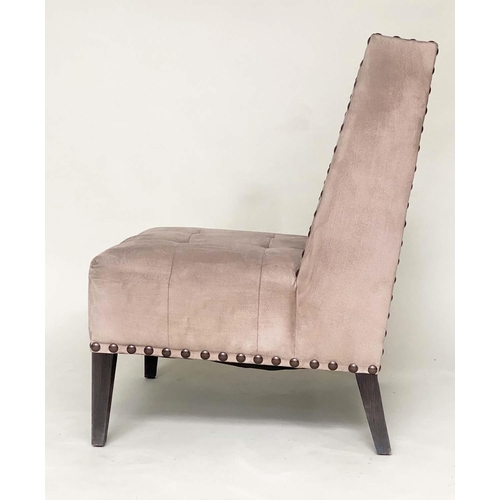 265 - WING CHAIR, brass studded and buttoned suede upholstered with tapering supports, 61cm W.