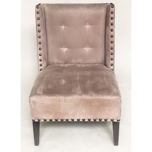 265 - WING CHAIR, brass studded and buttoned suede upholstered with tapering supports, 61cm W.