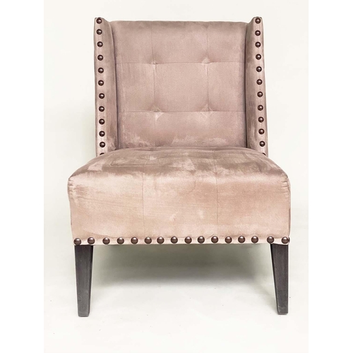 265 - WING CHAIR, brass studded and buttoned suede upholstered with tapering supports, 61cm W.