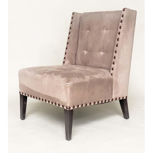 265 - WING CHAIR, brass studded and buttoned suede upholstered with tapering supports, 61cm W.