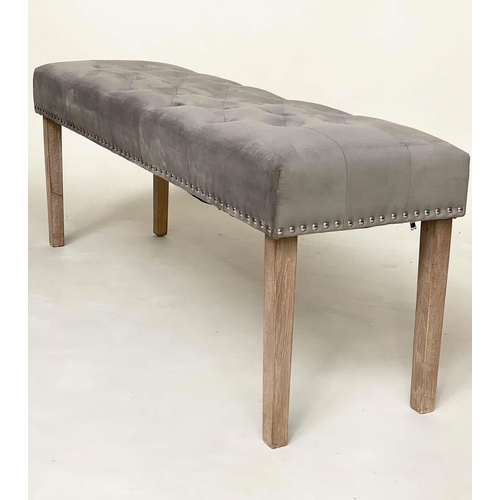 277 - WINDOW SEAT, rectangular deep buttoned velvet upholstered and brass slidded with tapering limed oak ... 