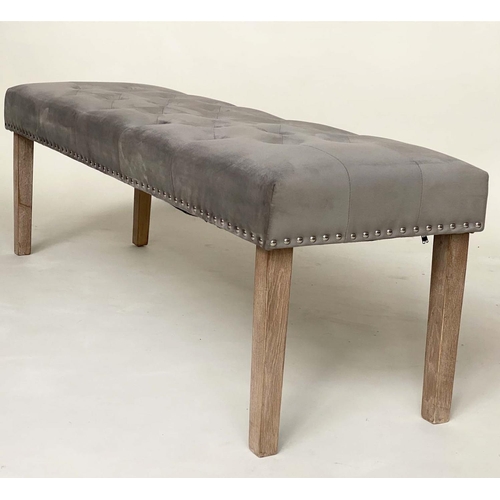 277 - WINDOW SEAT, rectangular deep buttoned velvet upholstered and brass slidded with tapering limed oak ... 