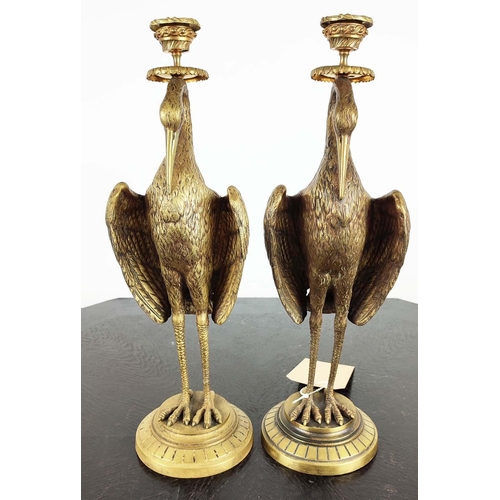 1 - HERON CANDLESTICKS, a pair, Victorian aesthetic style, gilt metal, 41cm H. (2)