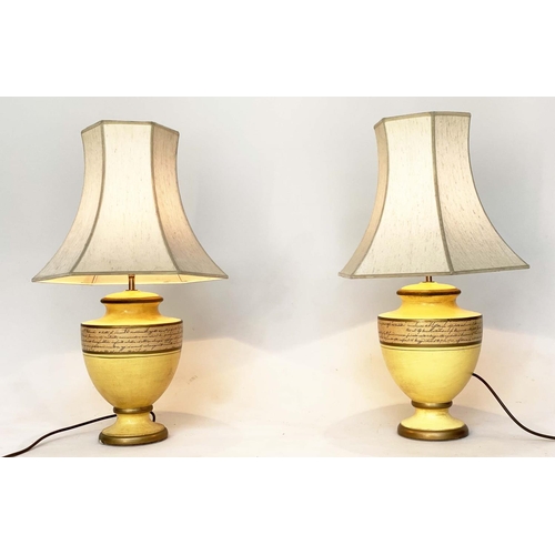 113 - TABLE LAMPS, a pair, yellow ceramic of urn form with Italian script and pagoda silk shades, 67cm H. ... 