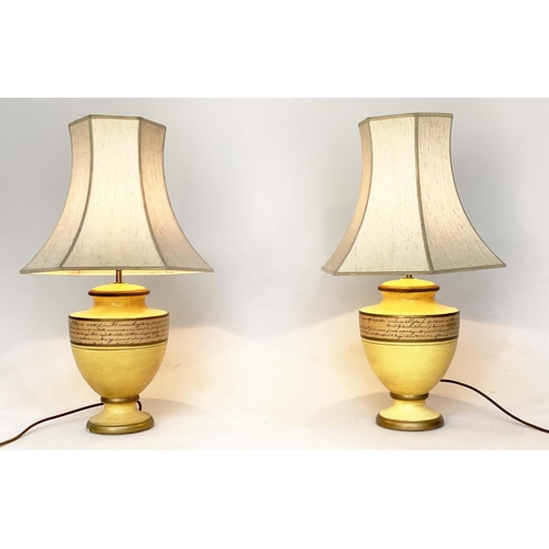 113 - TABLE LAMPS, a pair, yellow ceramic of urn form with Italian script and pagoda silk shades, 67cm H. ... 