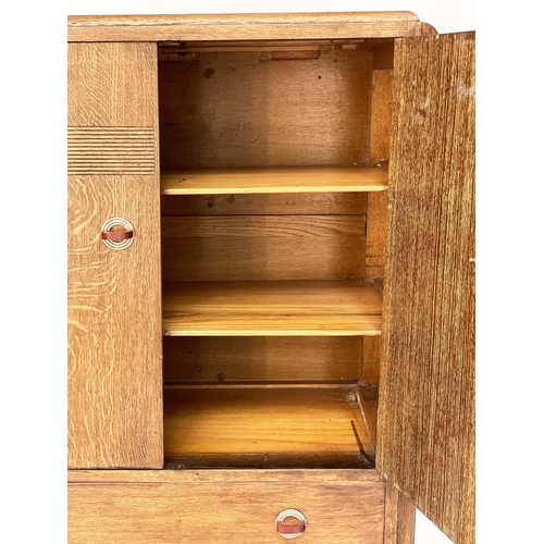 116 - ART DECO CABINET, limed oak with two panel doors enclosing shelves above two drawers, 90cm W x 125cm... 