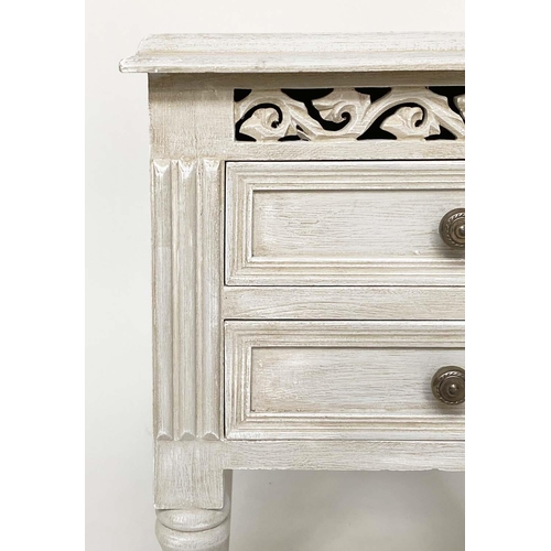 132 - BEDSIDE CHESTS, a pair, French style traditionally grey painted each with two drawer and pierced fri... 