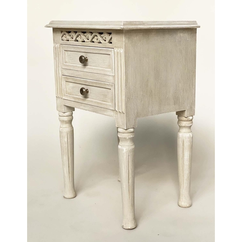 132 - BEDSIDE CHESTS, a pair, French style traditionally grey painted each with two drawer and pierced fri... 