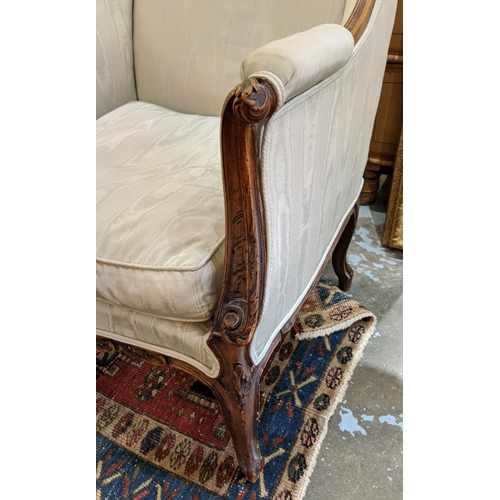 215 - BERGERE A OREILLES, 74cm W x 113cm H, 19th century French walnut carved showframe, with light blue s... 