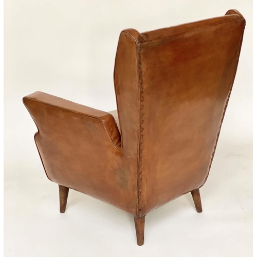 287 - WING ARMCHAIRS, a pair, 1950s Italian mid brown leather, with slightly splayed leather clad supports... 