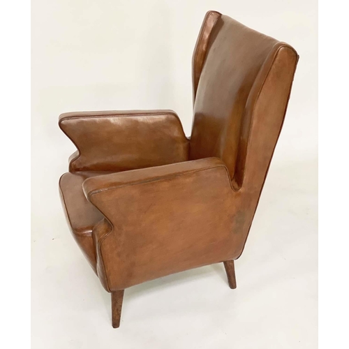 287 - WING ARMCHAIRS, a pair, 1950s Italian mid brown leather, with slightly splayed leather clad supports... 