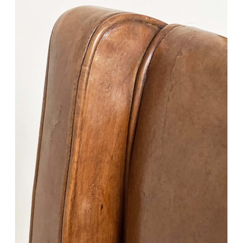 287 - WING ARMCHAIRS, a pair, 1950s Italian mid brown leather, with slightly splayed leather clad supports... 