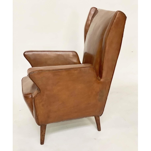 287 - WING ARMCHAIRS, a pair, 1950s Italian mid brown leather, with slightly splayed leather clad supports... 