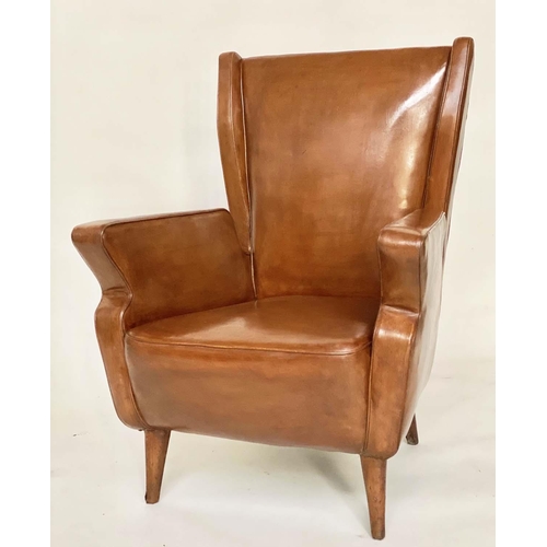 287 - WING ARMCHAIRS, a pair, 1950s Italian mid brown leather, with slightly splayed leather clad supports... 