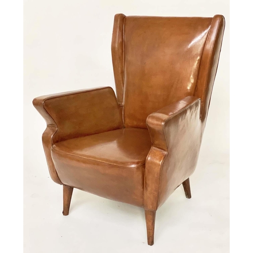 287 - WING ARMCHAIRS, a pair, 1950s Italian mid brown leather, with slightly splayed leather clad supports... 