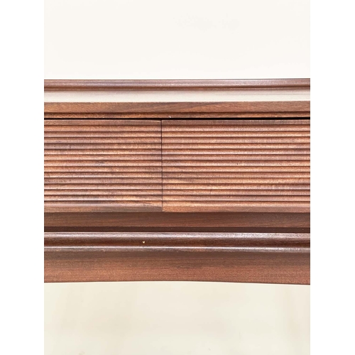 293 - RICHARD HORNBY TABLE, 1970s teak with two blind frieze drawers with reeded fronts, 114cm W x 48cm D ... 