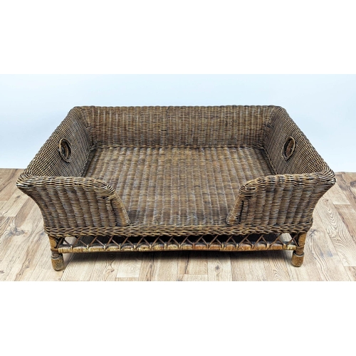 495 - OKA RATTAN MATTABAN PET BED, 77cm D x 44cm H x 108cm W.