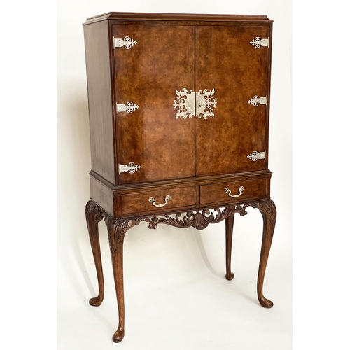 112 - COCKTAIL CABINET, Queen Anne style burr walnut and silvered metal mounted with two doors and carved ... 