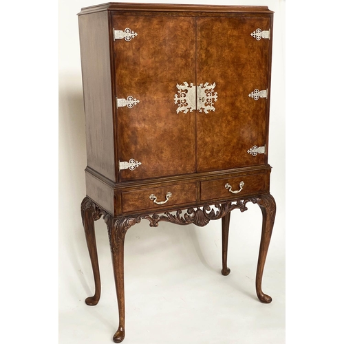 112 - COCKTAIL CABINET, Queen Anne style burr walnut and silvered metal mounted with two doors and carved ... 